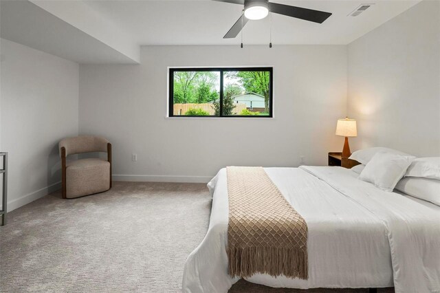 bedroom with baseboards, carpet, ceiling fan, and visible vents