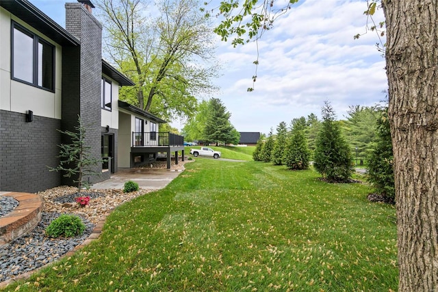 view of yard featuring a deck