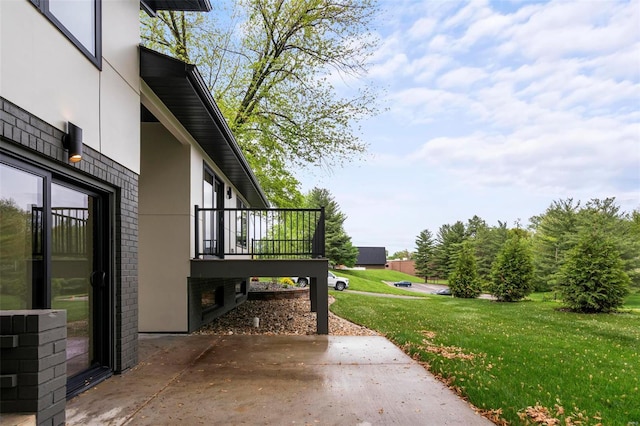 exterior space with a wooden deck and a patio area