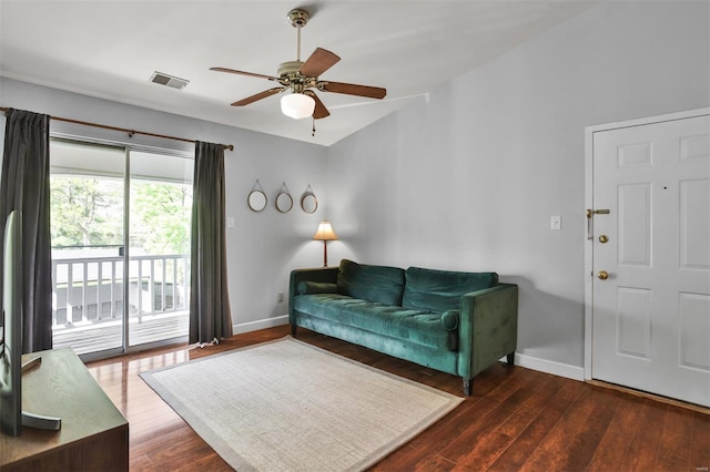 living room featuring visible vents, baseboards, ceiling fan, and wood finished floors