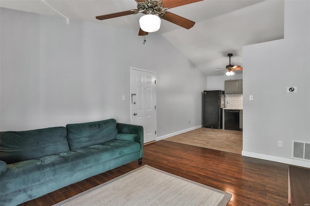 living room with ceiling fan, high vaulted ceiling, baseboards, wood finished floors, and visible vents