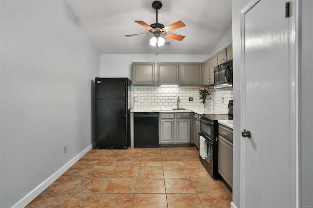 kitchen with ceiling fan, light countertops, tasteful backsplash, a sink, and black appliances