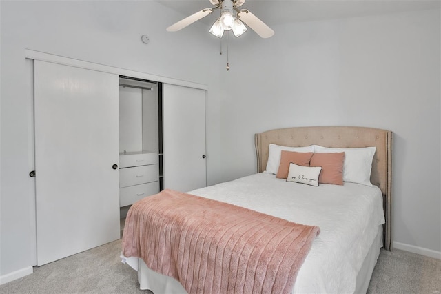 bedroom with a closet, carpet flooring, and a ceiling fan