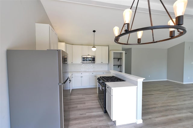 kitchen featuring stainless steel appliances, light wood finished floors, white cabinetry, decorative backsplash, and light countertops