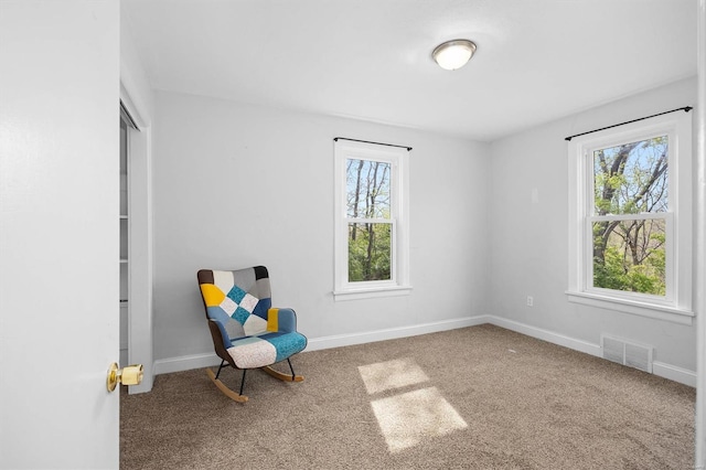 unfurnished room with visible vents, baseboards, and carpet floors
