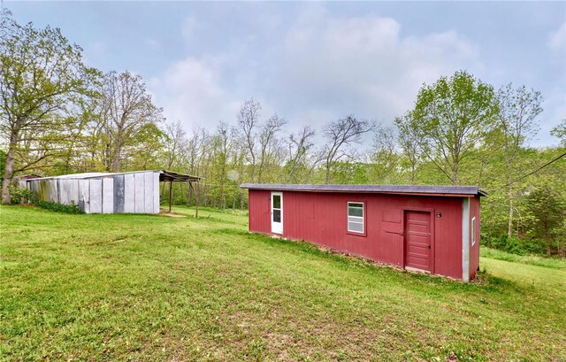 view of pole building with a yard