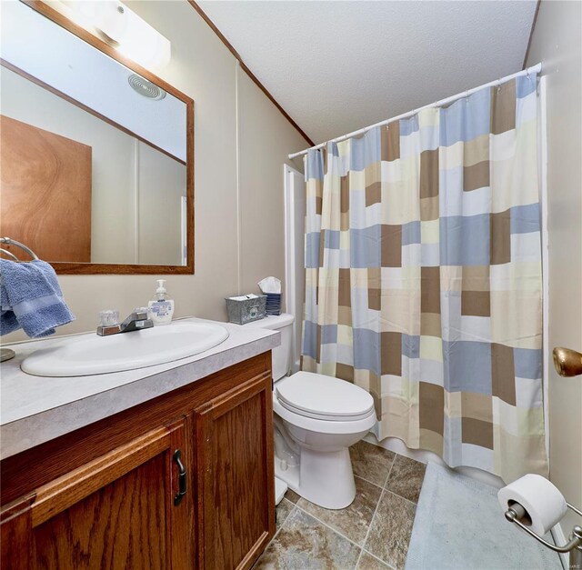 full bathroom featuring vanity, crown molding, toilet, a shower with shower curtain, and a textured ceiling