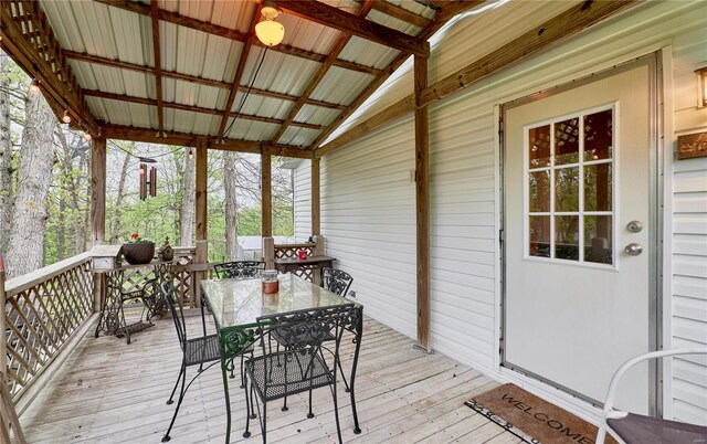 wooden terrace with outdoor dining space