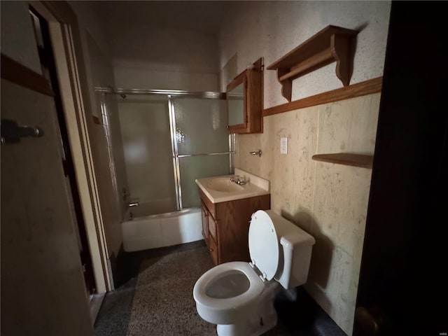 full bathroom with toilet, enclosed tub / shower combo, and vanity