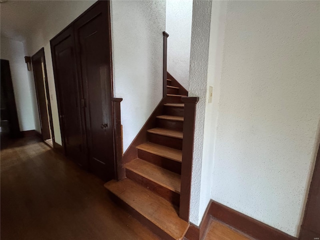 stairs with wood finished floors