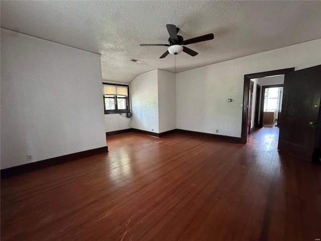 unfurnished living room with visible vents, a ceiling fan, a textured ceiling, and a wealth of natural light
