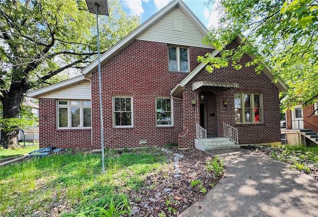 view of front of home with brick siding