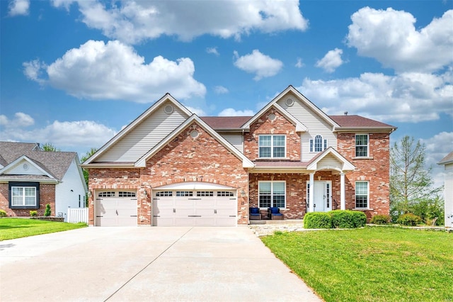 craftsman-style house featuring brick siding, a garage, a front lawn, and concrete driveway