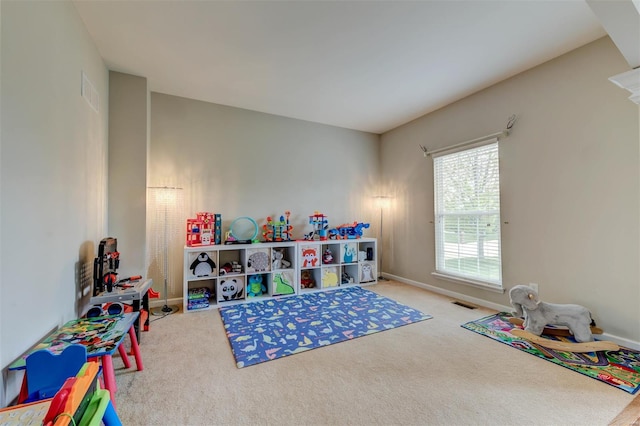 game room with baseboards, visible vents, and carpet