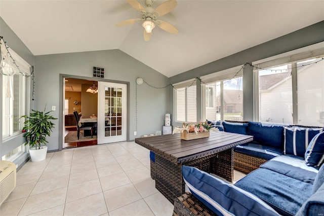 sunroom with tile patterned floors and lofted ceiling