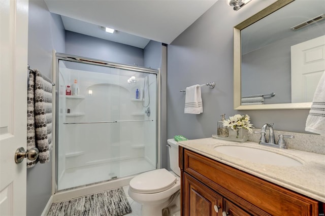 full bath featuring visible vents, a stall shower, toilet, and vanity