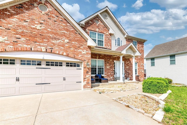 craftsman inspired home with concrete driveway, brick siding, and a porch