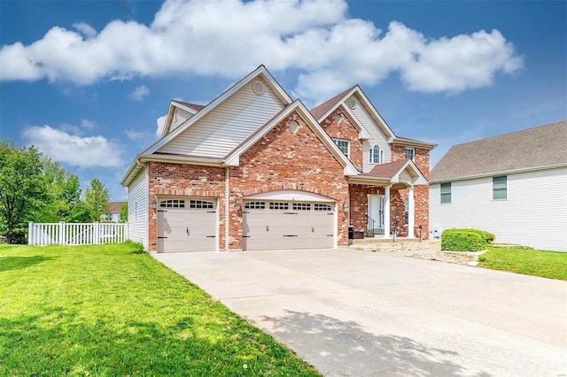 craftsman-style house with a garage, a front lawn, fence, brick siding, and driveway