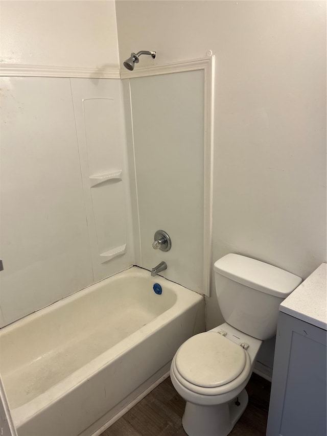 bathroom featuring vanity, wood finished floors, and toilet