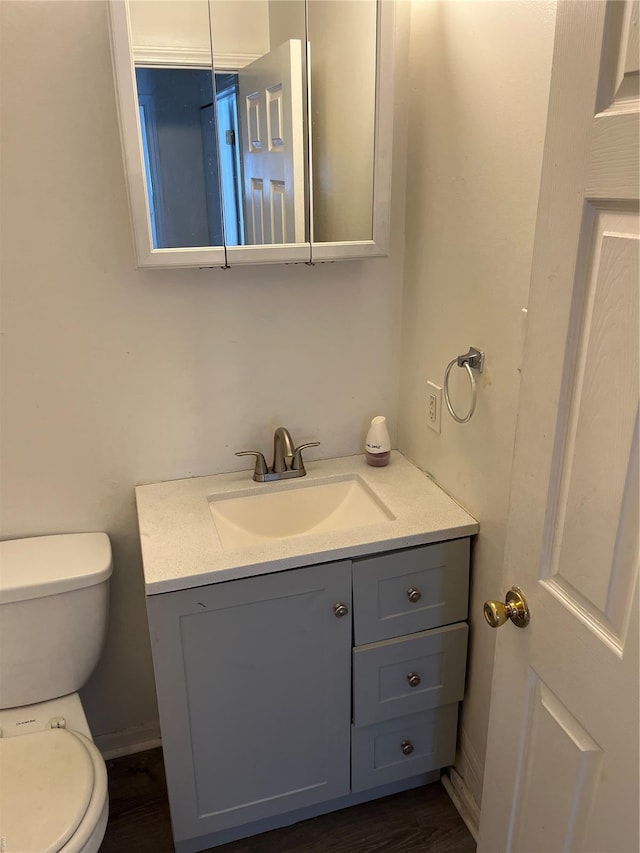 bathroom with vanity and toilet
