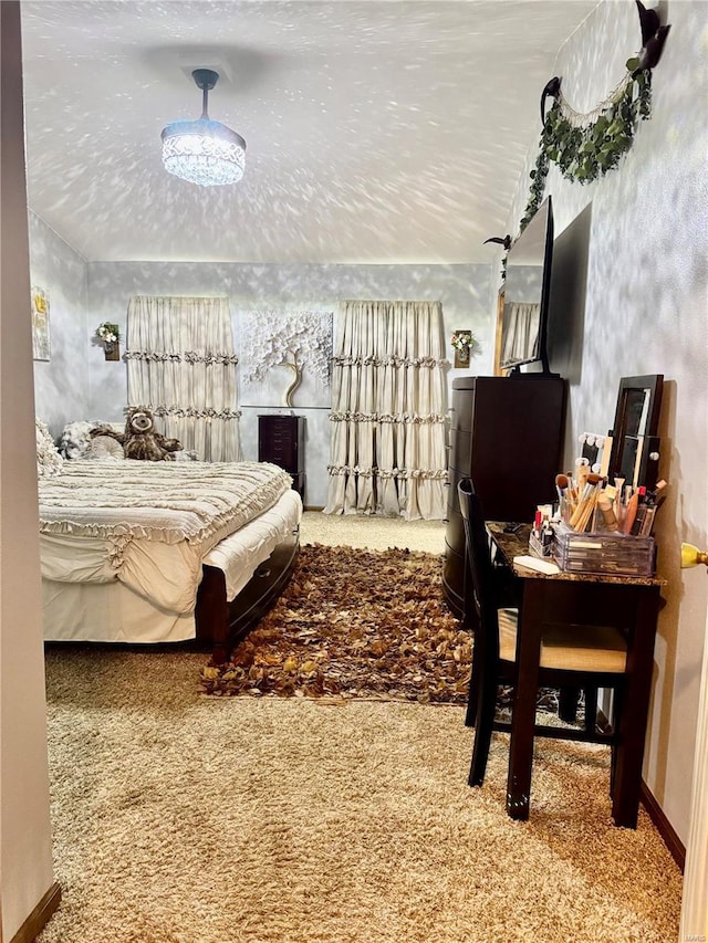 carpeted bedroom with baseboards