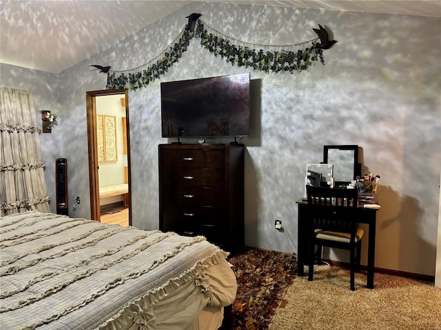 carpeted bedroom with lofted ceiling