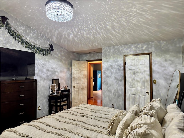 bedroom featuring vaulted ceiling