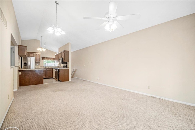 unfurnished living room featuring light colored carpet, baseboards, and vaulted ceiling