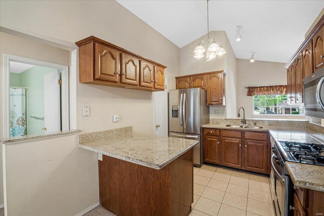 kitchen with a peninsula, a chandelier, a sink, vaulted ceiling, and stainless steel appliances