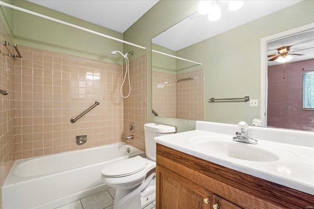 full bathroom featuring ceiling fan, shower / washtub combination, tile patterned floors, vanity, and toilet