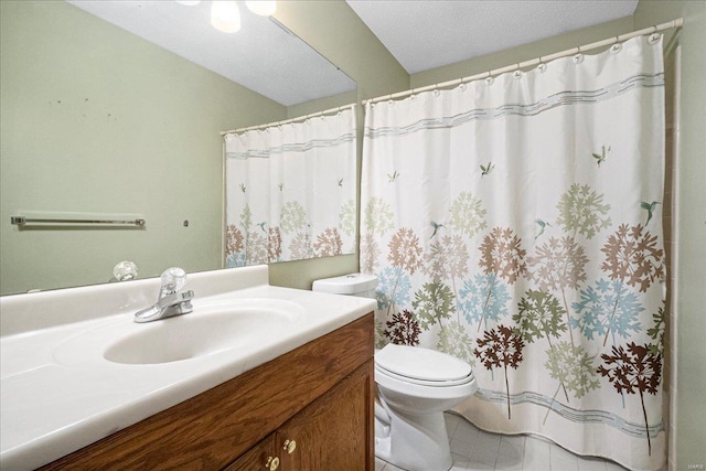 bathroom with vanity, tile patterned floors, a shower with curtain, and toilet