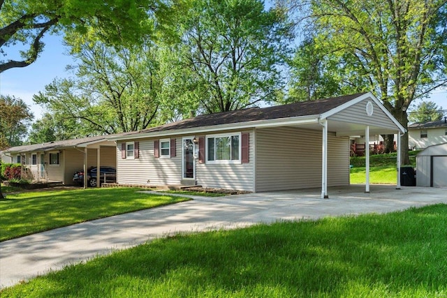 ranch-style home with an attached carport, a front yard, and concrete driveway