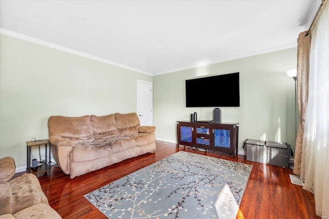 living room with crown molding, baseboards, and wood finished floors