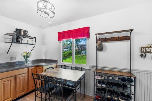 dining room with wainscoting and light wood finished floors