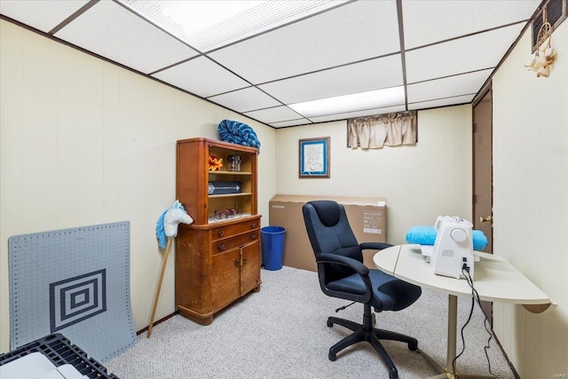 carpeted office with a drop ceiling