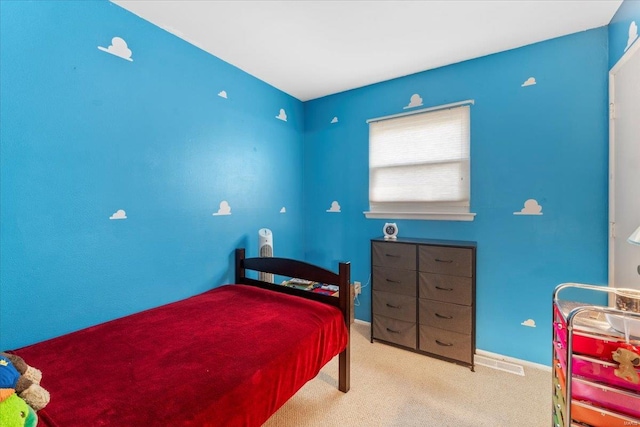 bedroom featuring carpet flooring and baseboards