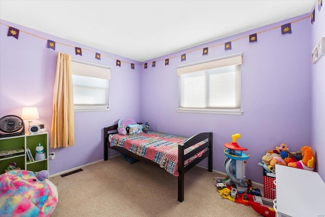 bedroom with carpet flooring and visible vents