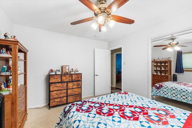 bedroom featuring baseboards, a ceiling fan, and carpet flooring