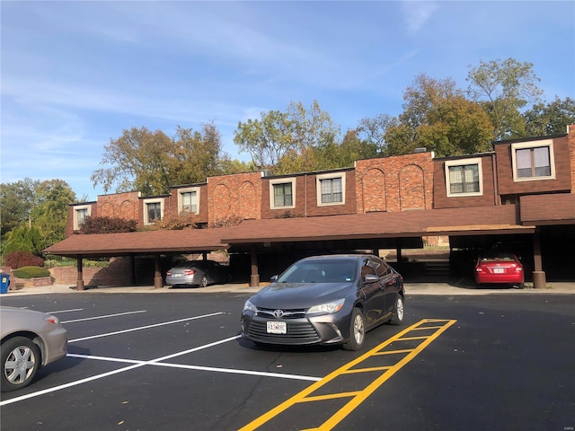 view of partially covered parking lot
