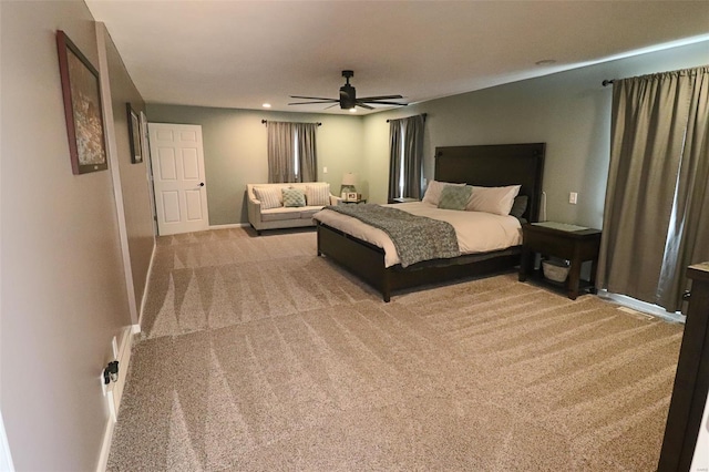 carpeted bedroom featuring baseboards, a ceiling fan, and recessed lighting