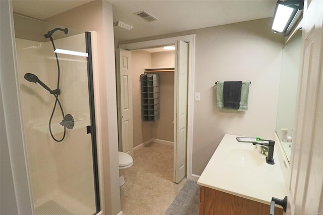 full bathroom featuring visible vents, a shower stall, and vanity