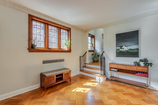 interior space with arched walkways and baseboards