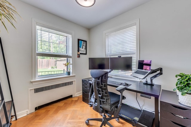 home office featuring baseboards and radiator