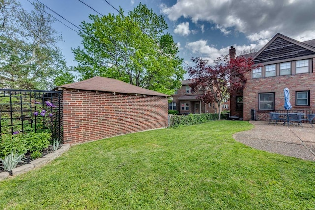 view of yard with fence and a patio area