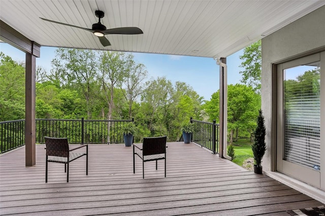wooden terrace featuring a ceiling fan