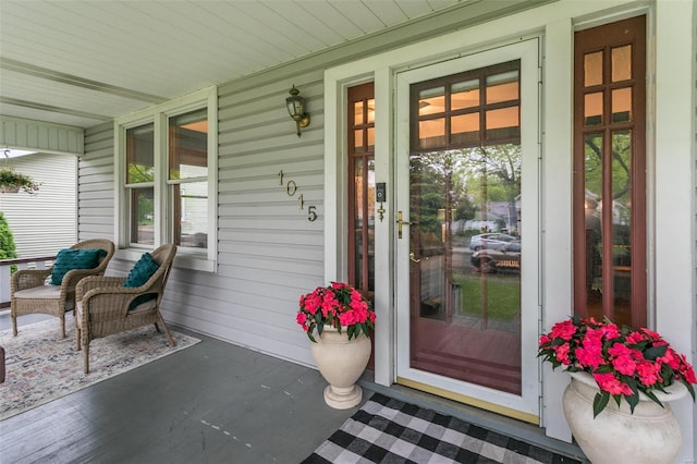 doorway to property featuring a porch