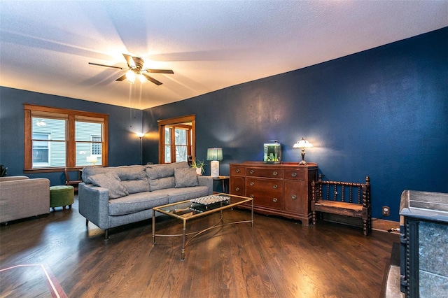 living room with a ceiling fan and wood finished floors