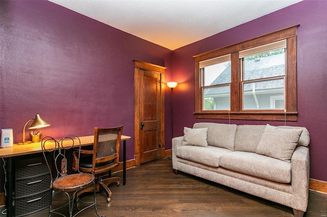 office area with baseboards and wood finished floors