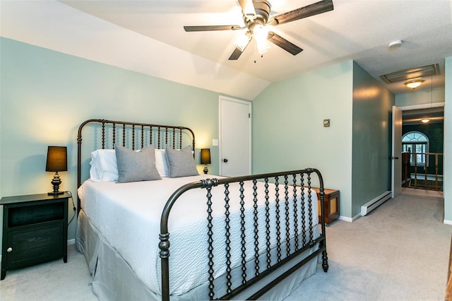 bedroom featuring visible vents, lofted ceiling, light carpet, baseboards, and baseboard heating