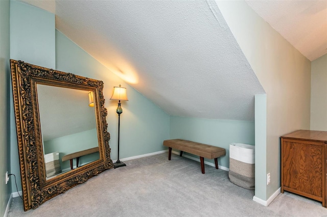 bonus room featuring a textured ceiling, carpet, and vaulted ceiling